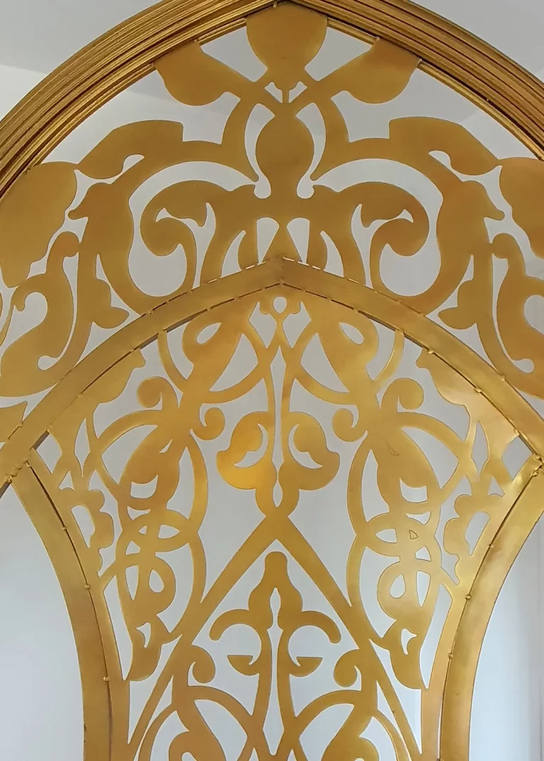 Close up of a golden decorative arch